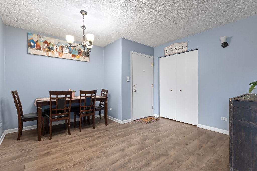 10531 South Roberts Road, Unit 2D Palos Hills, IL 60465 - Photo 9 of 13 a view of a dining room with furniture and chandelier