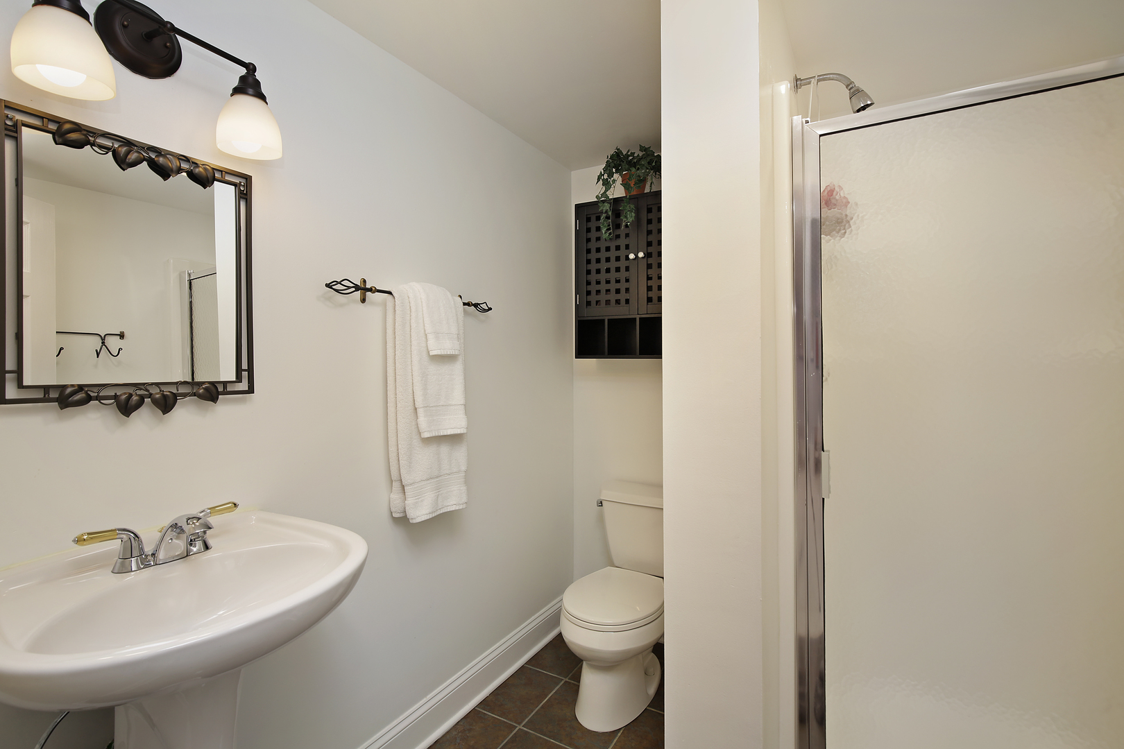 2224 Crabtree Lane Northbrook, IL 60062 - Photo 19 of 34 a bathroom with a sink toilet and shower