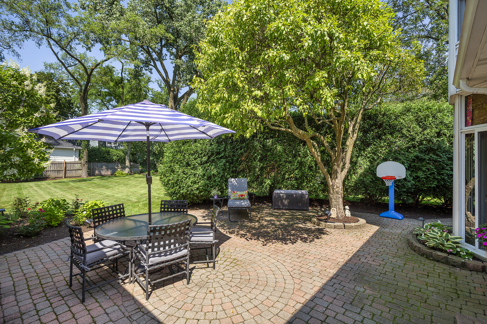2224 Crabtree Lane Northbrook, IL 60062 - Photo 23 of 34 a view of a table and chairs under an umbrella in the patio