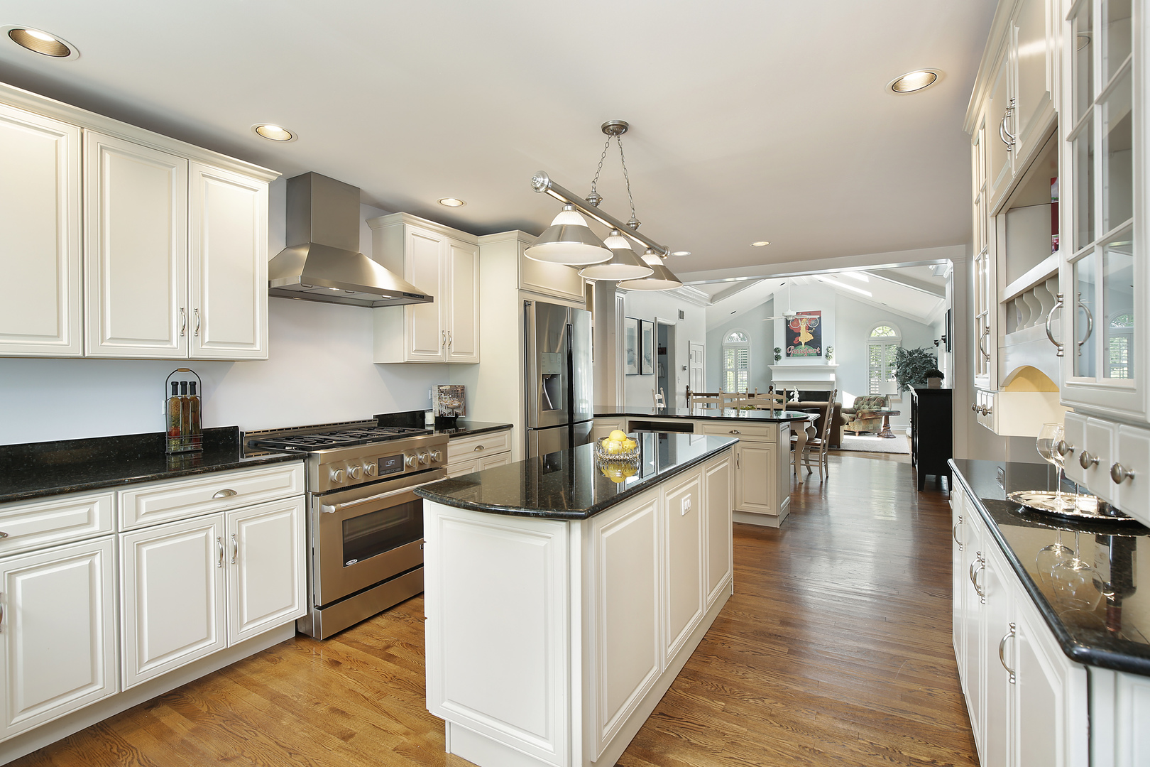 2224 Crabtree Lane Northbrook, IL 60062 - Photo 7 of 34 a kitchen with stainless steel appliances kitchen island granite countertop a stove top oven a sink a counter space and cabinets