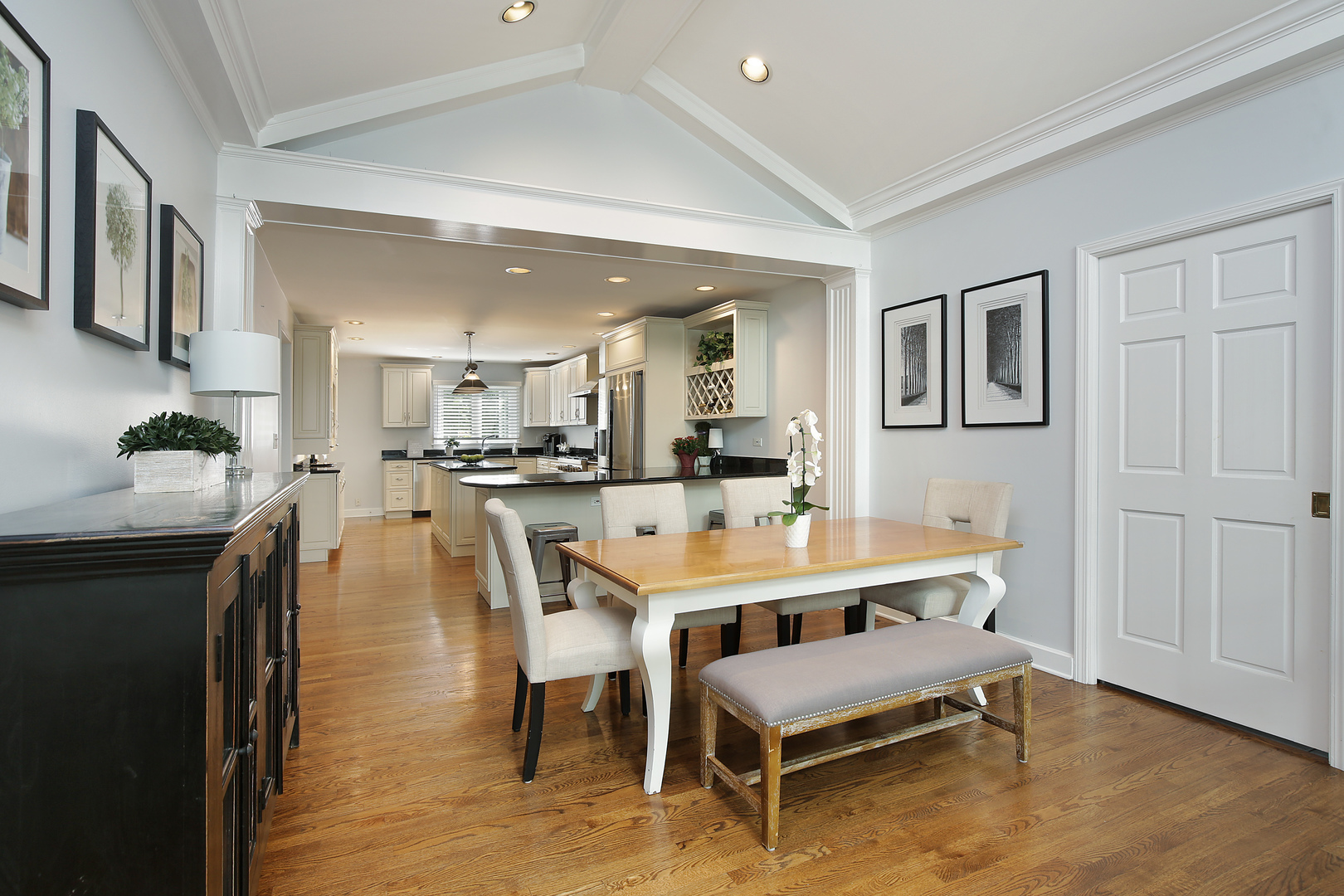 2224 Crabtree Lane Northbrook, IL 60062 - Photo 8 of 34 a dining hall with stainless steel appliances kitchen island granite countertop a dining table and chairs