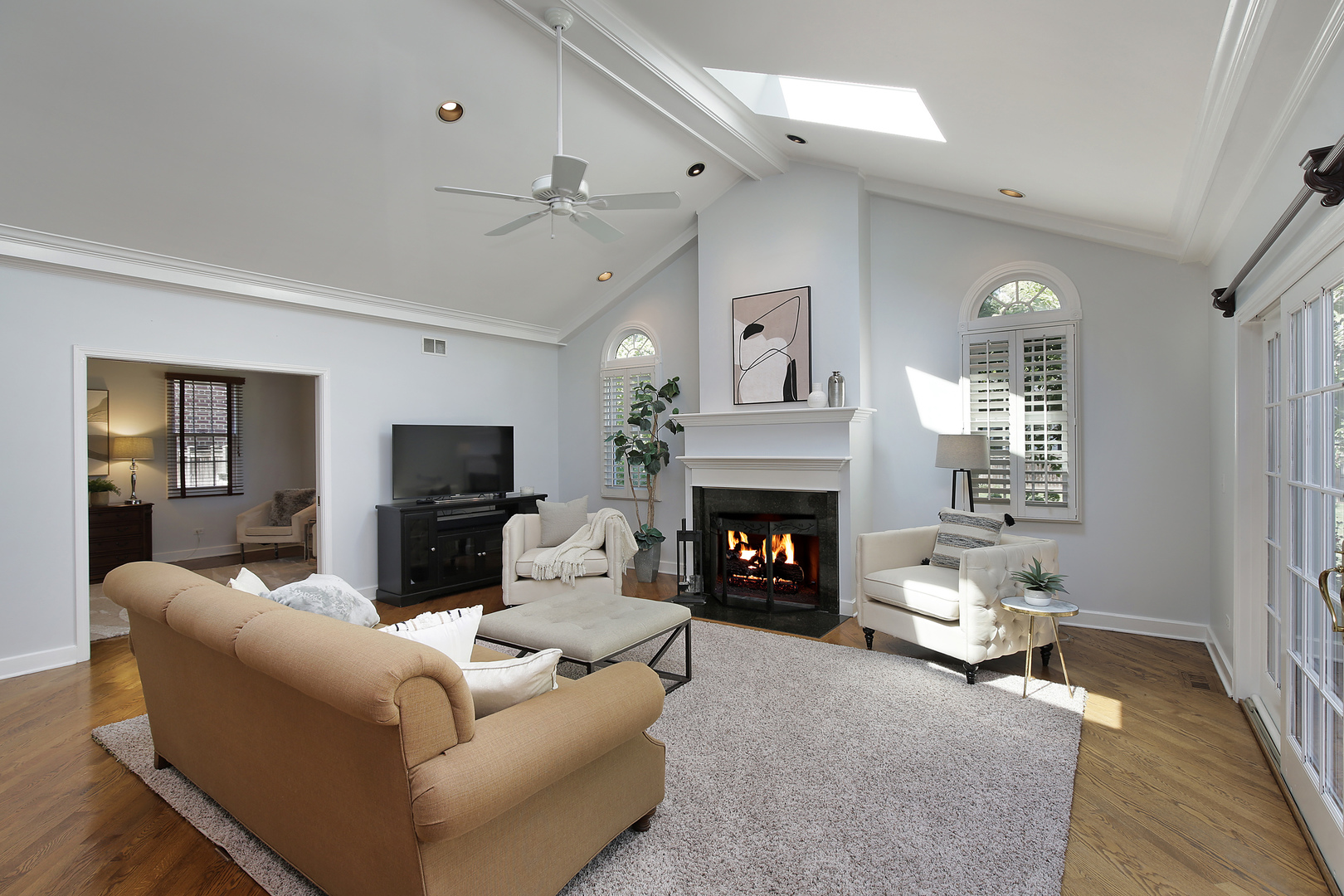 2224 Crabtree Lane Northbrook, IL 60062 - Photo 10 of 34 a living room with furniture a fireplace and a flat screen tv