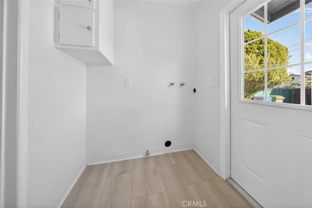 a bathroom with a toilet a sink and a window