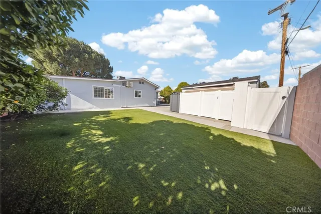 a view of a park with large trees
