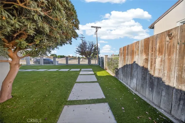 a view of a house with a dry back yard
