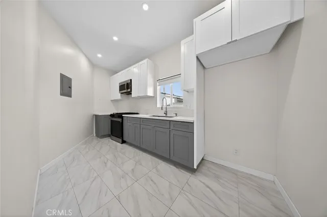 a white toilet sitting next to a bathroom sink