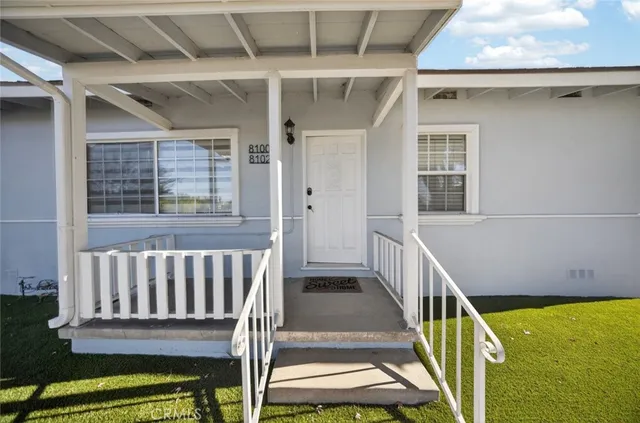 a large white kitchen with cabinets