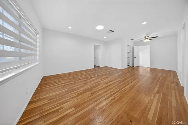 a kitchen with white cabinets and sink