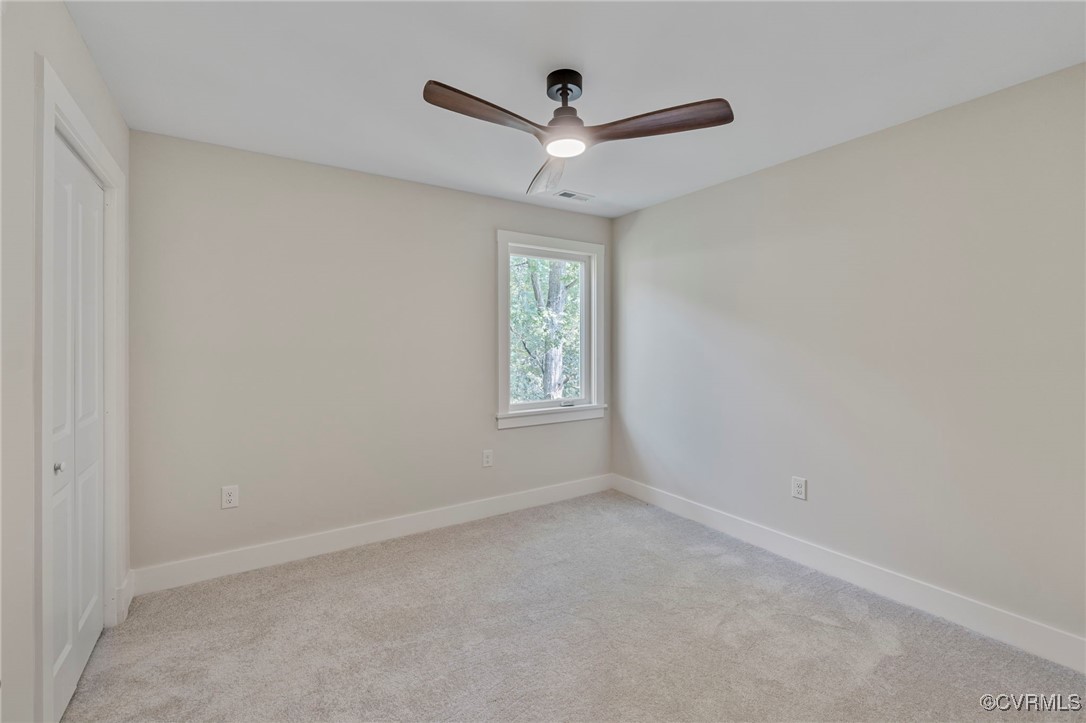 34 Turkeysag Trail Palmyra, VA 22963 - Photo 20 of 44 an empty room with a window and a ceiling fan