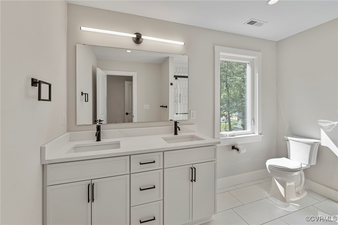 34 Turkeysag Trail Palmyra, VA 22963 - Photo 21 of 44 a bathroom with a toilet sink and mirror