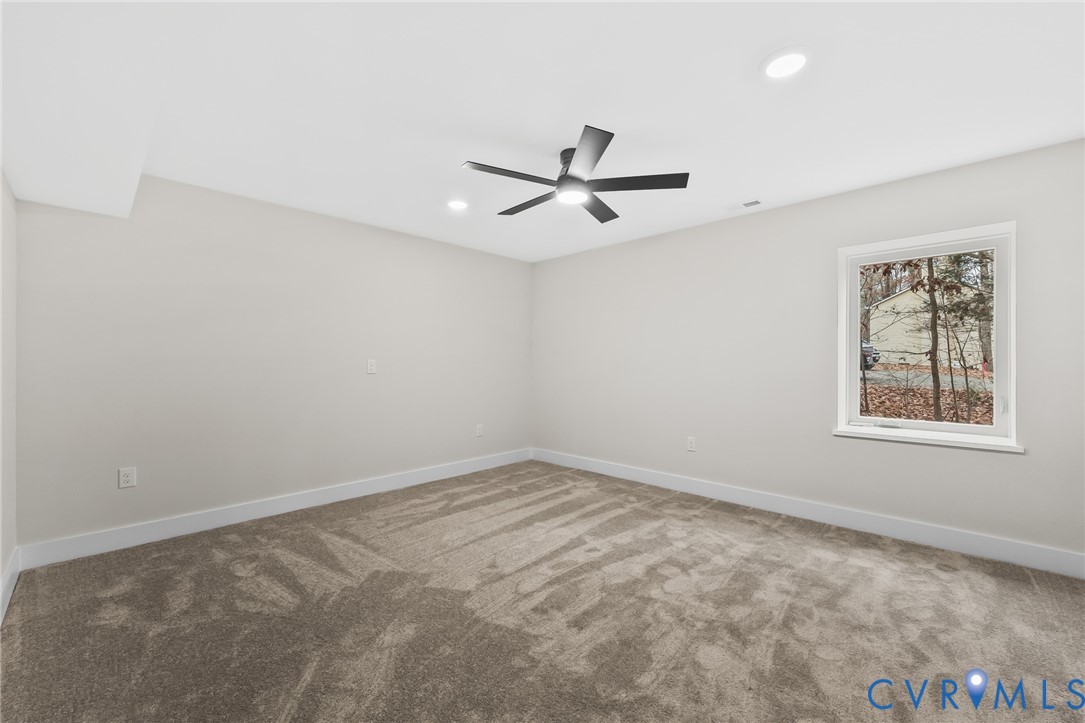 34 Turkeysag Trail Palmyra, VA 22963 - Photo 28 of 44 an empty room with a window and a ceiling fan