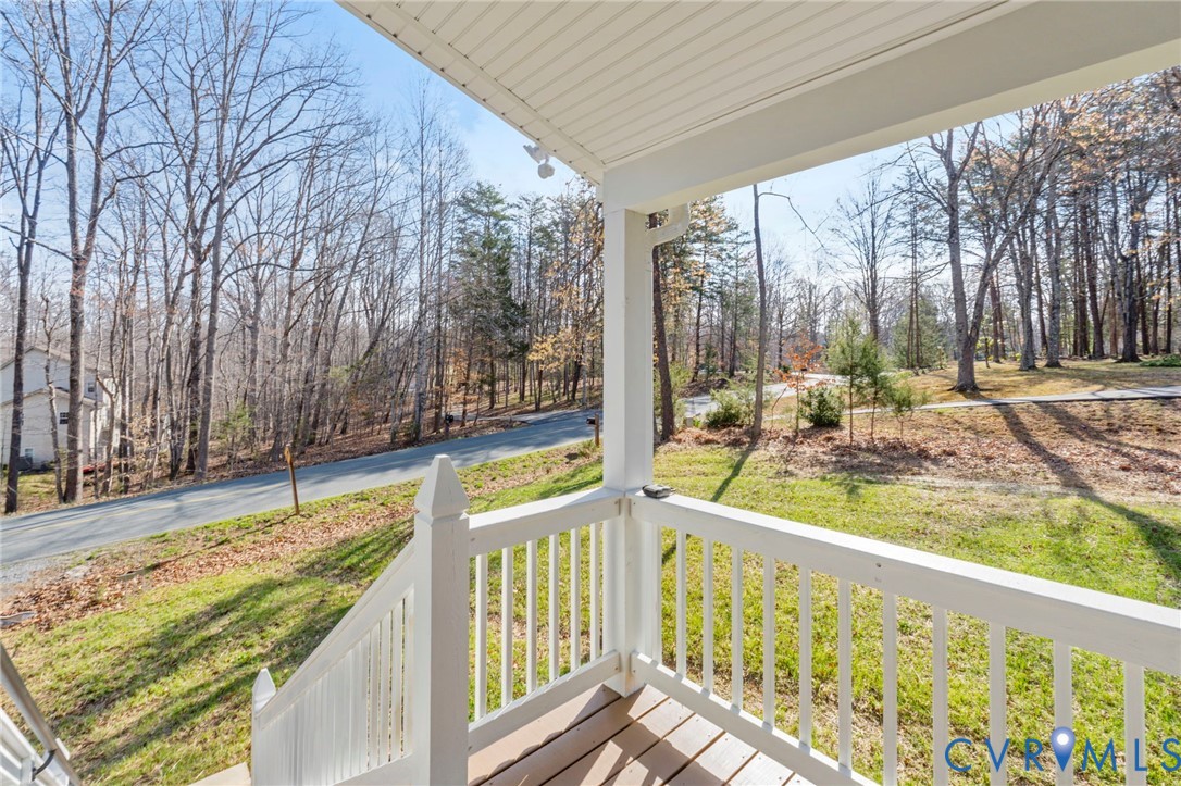 34 Turkeysag Trail Palmyra, VA 22963 - Photo 43 of 44 a view of a porch with a floor to ceiling window and a small yard