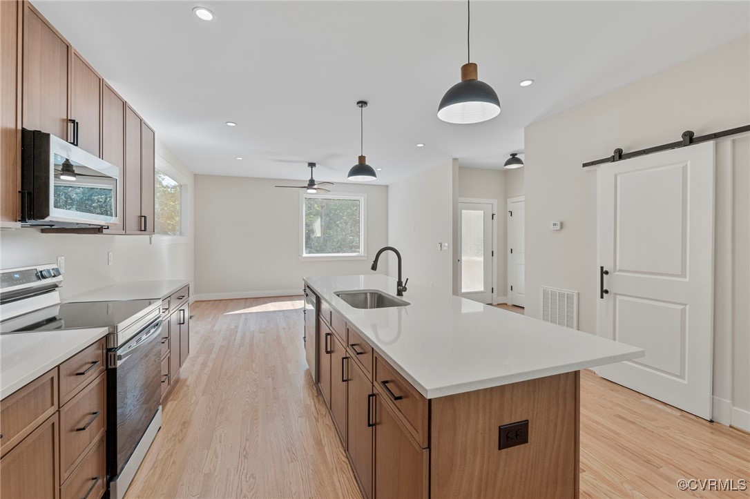 34 Turkeysag Trail Palmyra, VA 22963 - Photo 8 of 44 a kitchen with a sink refrigerator and cabinets
