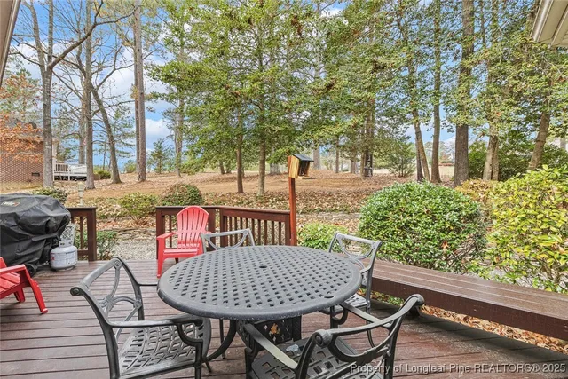 a view of balcony with wooden floor and outdoor seating