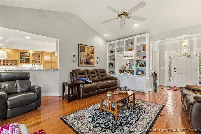 a living room with furniture and a rug