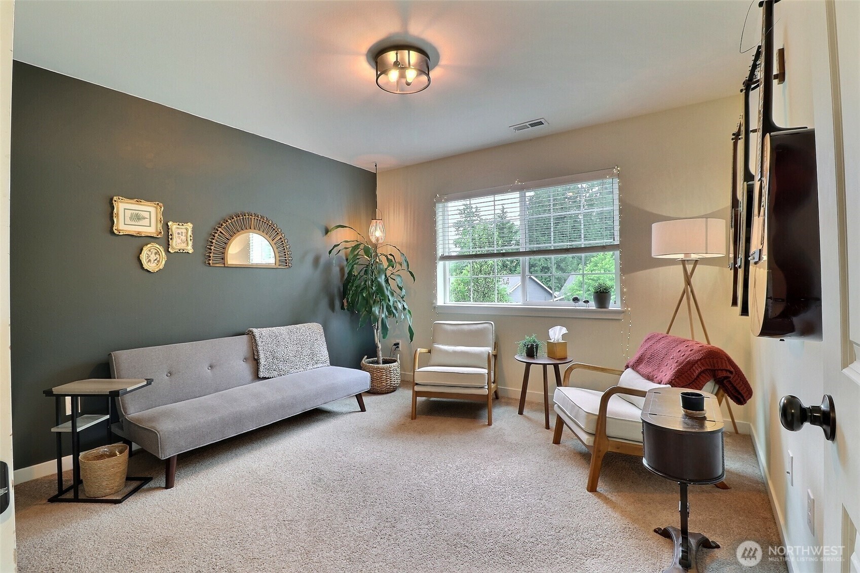 19776 Mountain Ridge Road Southeast Monroe, WA 98272 - Photo 25 of 40 a living room with furniture and a large window