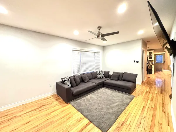 a living room with a couch and a rug