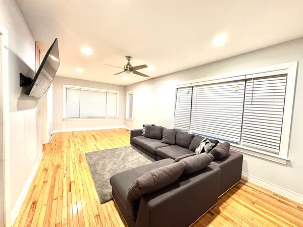 a living room with furniture and a rug