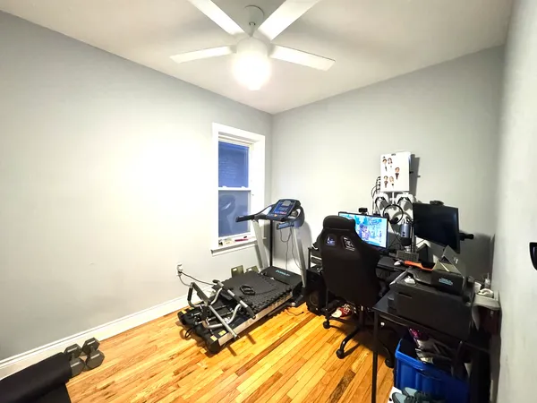 a room with furniture and a air conditioner vent