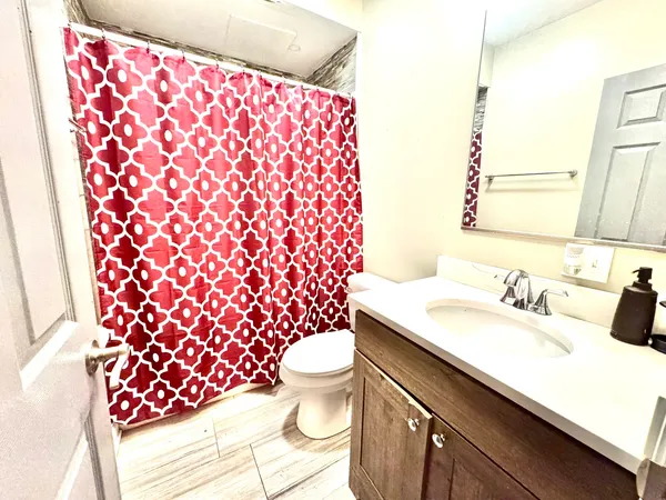 a bathroom with a sink and a toilet