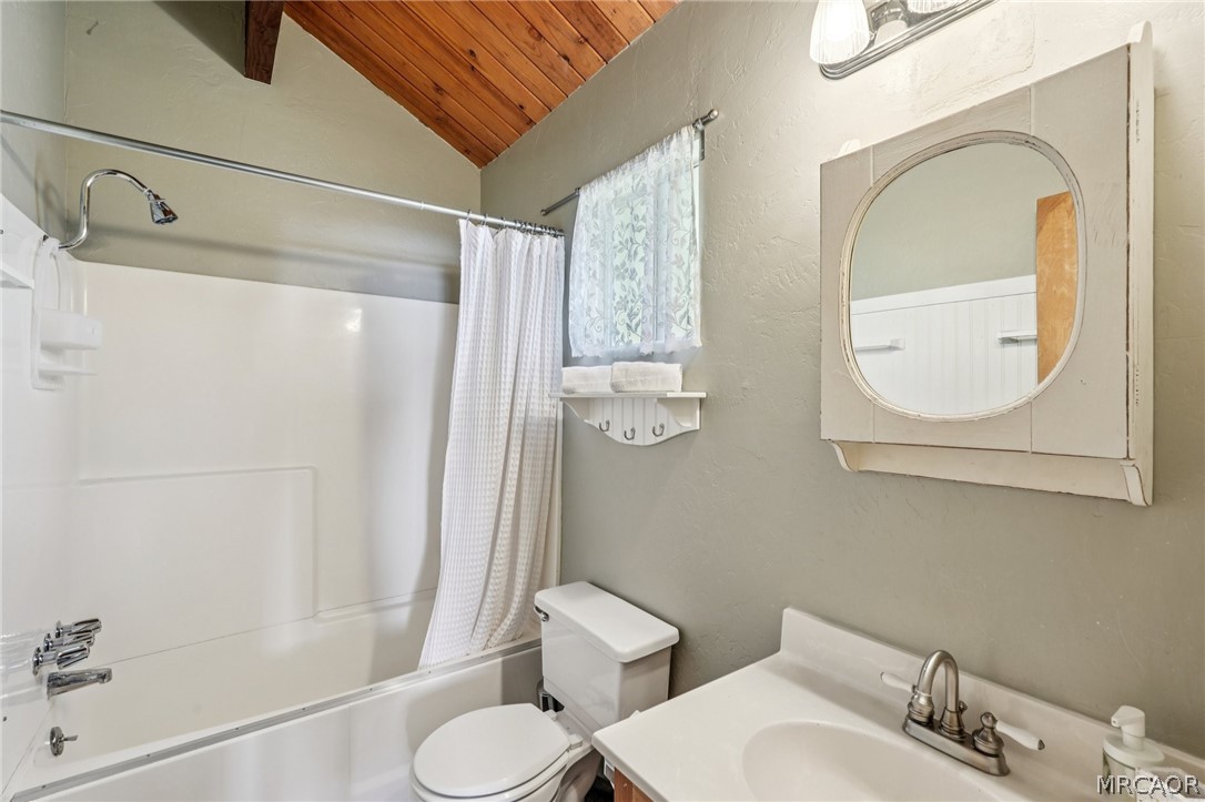 2409 Spring Oak Drive Running Springs, CA 92382 - Photo 16 of 24 a bathroom with a toilet sink and shower