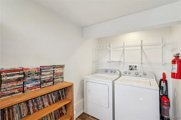 a view of storage and utility room with washer and dryer