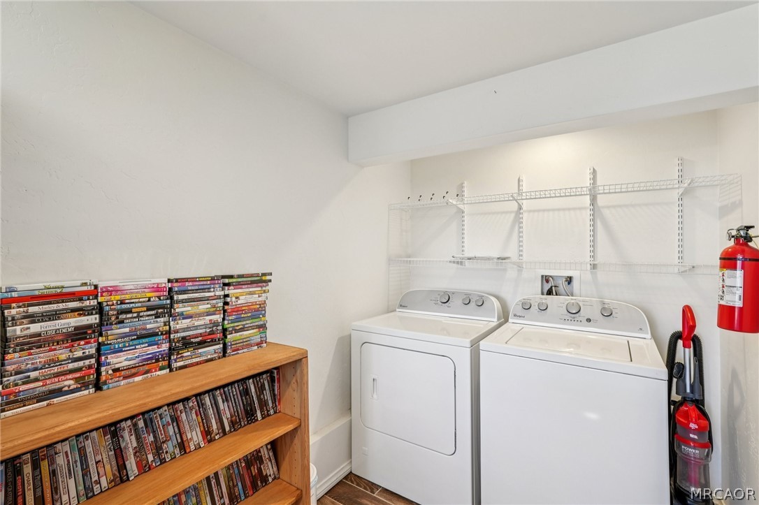 2409 Spring Oak Drive Running Springs, CA 92382 - Photo 17 of 24 a view of storage and utility room with washer and dryer