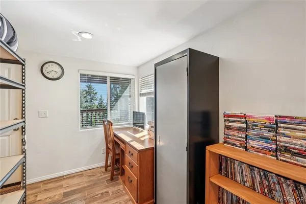 a room with furniture a window and a wooden floor