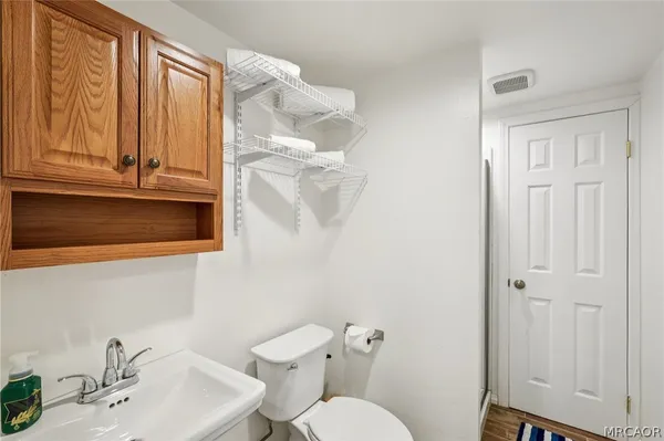 a bathroom with a sink a toilet and tub