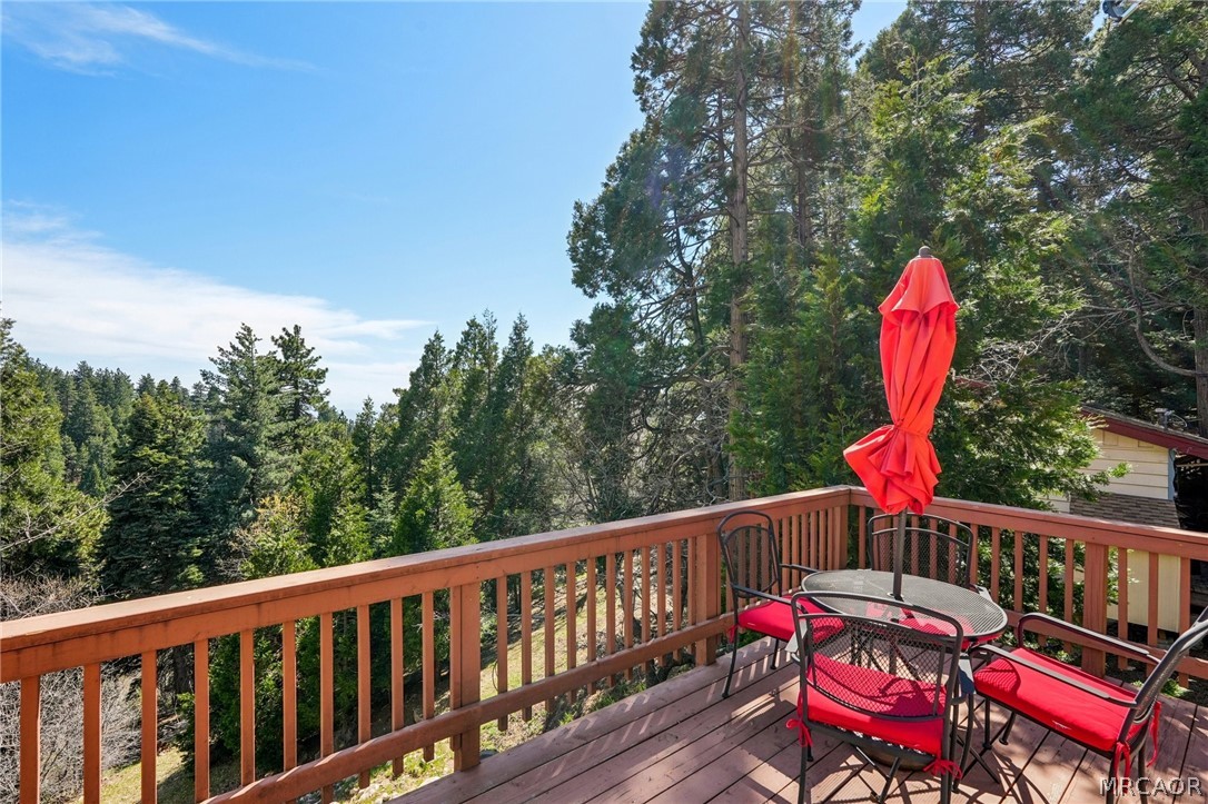 2409 Spring Oak Drive Running Springs, CA 92382 - Photo 2 of 24 a balcony with with a swing