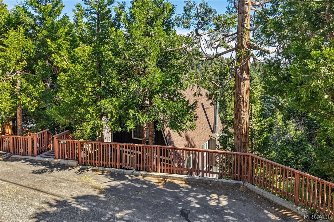 2409 Spring Oak Drive Running Springs, CA 92382 - Photo 3 of 24 a view of a deck with a trees