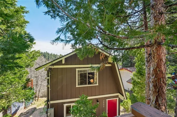 a aerial view of a house with a yard