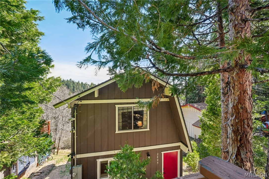 2409 Spring Oak Drive Running Springs, CA 92382 - Photo 4 of 24 a aerial view of a house with a yard