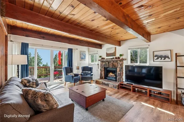 a living room with fireplace furniture and a flat screen tv