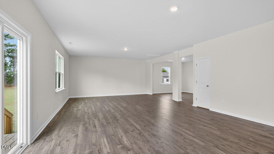 189 Calebs Cor Place Spring Lake, NC 28390 - Photo 12 of 42 a view of an empty room with wooden floor and a window