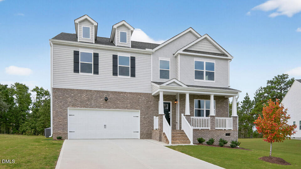 189 Calebs Cor Place Spring Lake, NC 28390 - Photo 3 of 42 a front view of a house with a yard