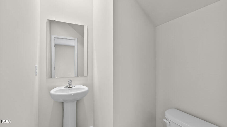 189 Calebs Cor Place Spring Lake, NC 28390 - Photo 31 of 42 a bathroom with a sink and mirror