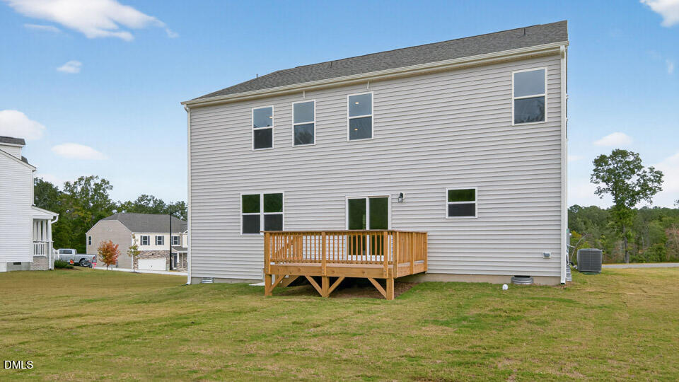 189 Calebs Cor Place Spring Lake, NC 28390 - Photo 36 of 42 a backyard of a house with table and chairs