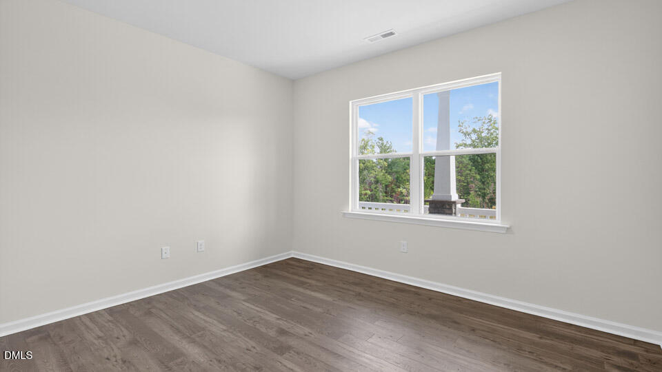 189 Calebs Cor Place Spring Lake, NC 28390 - Photo 6 of 42 an empty room with wooden floor and windows