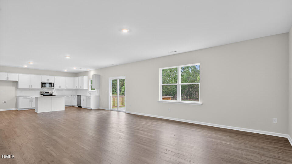 189 Calebs Cor Place Spring Lake, NC 28390 - Photo 10 of 42 a view of a large kitchen with wooden floor and a window