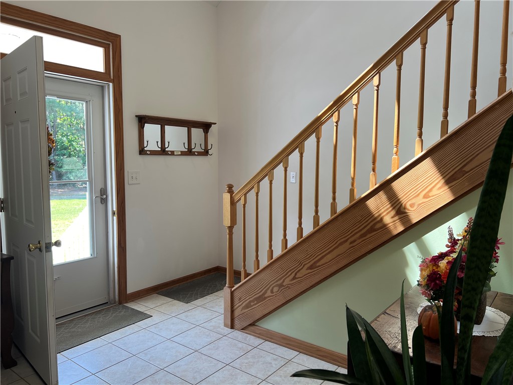 1419 Mill Creek Road Wake, VA 23176 - Photo 17 of 49 Entryway featuring light tile patterned flooring and stairway