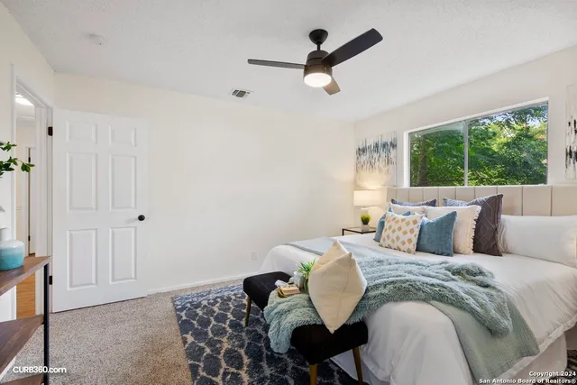 a bed room with a bed and a couch