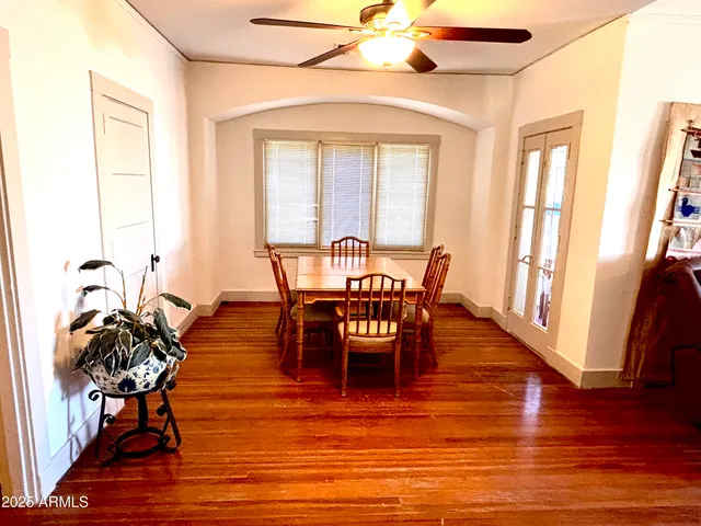 a view of an entryway door with wooden floor