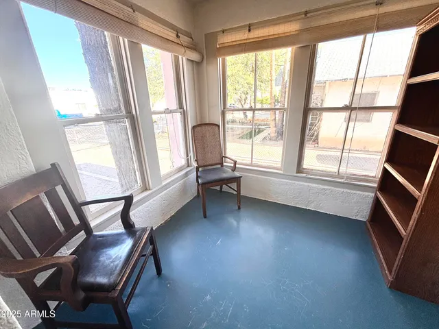 a room with wooden floor and furniture