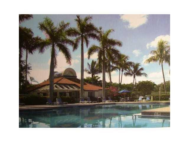 621 Lyons Road, Unit 9101 Coconut Creek, FL 33063 - Photo 11 of 21 a view of swimming pool and lake view