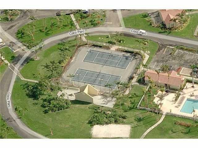 621 Lyons Road, Unit 9101 Coconut Creek, FL 33063 - Photo 21 of 21 an aerial view of a house with a yard