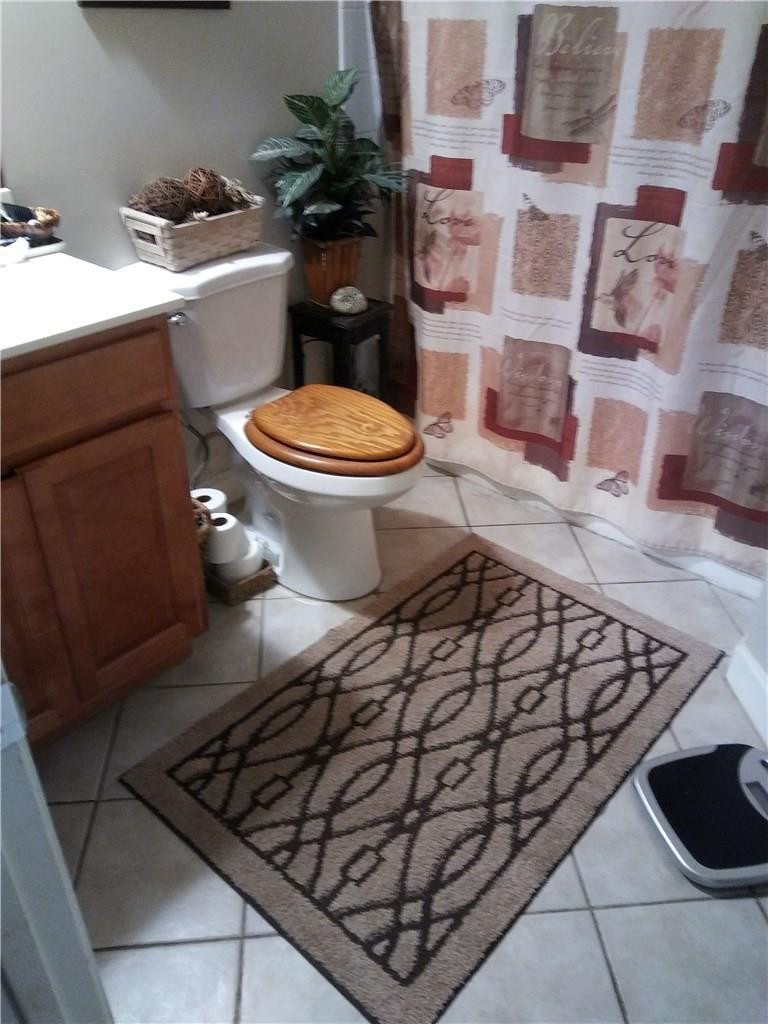 621 Lyons Road, Unit 9101 Coconut Creek, FL 33063 - Photo 4 of 21 a bathroom with a toilet and a sink