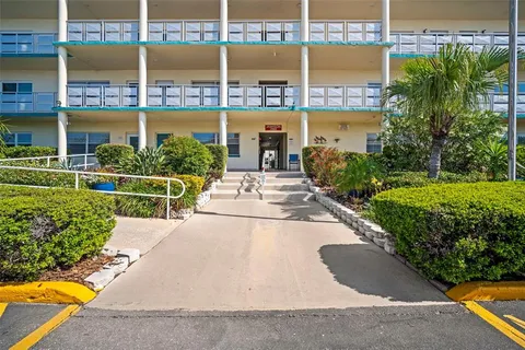 a view of a hallway with dining area