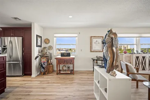 a view of kitchen with furniture and wooden floor