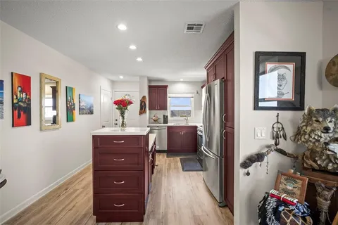 a bed room with a bed and a dresser